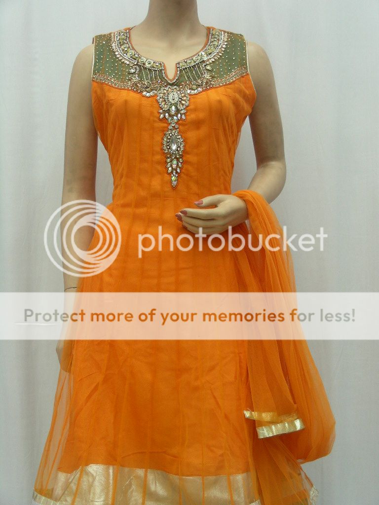 This Orange readymade net churidar kameez is adorned with beads